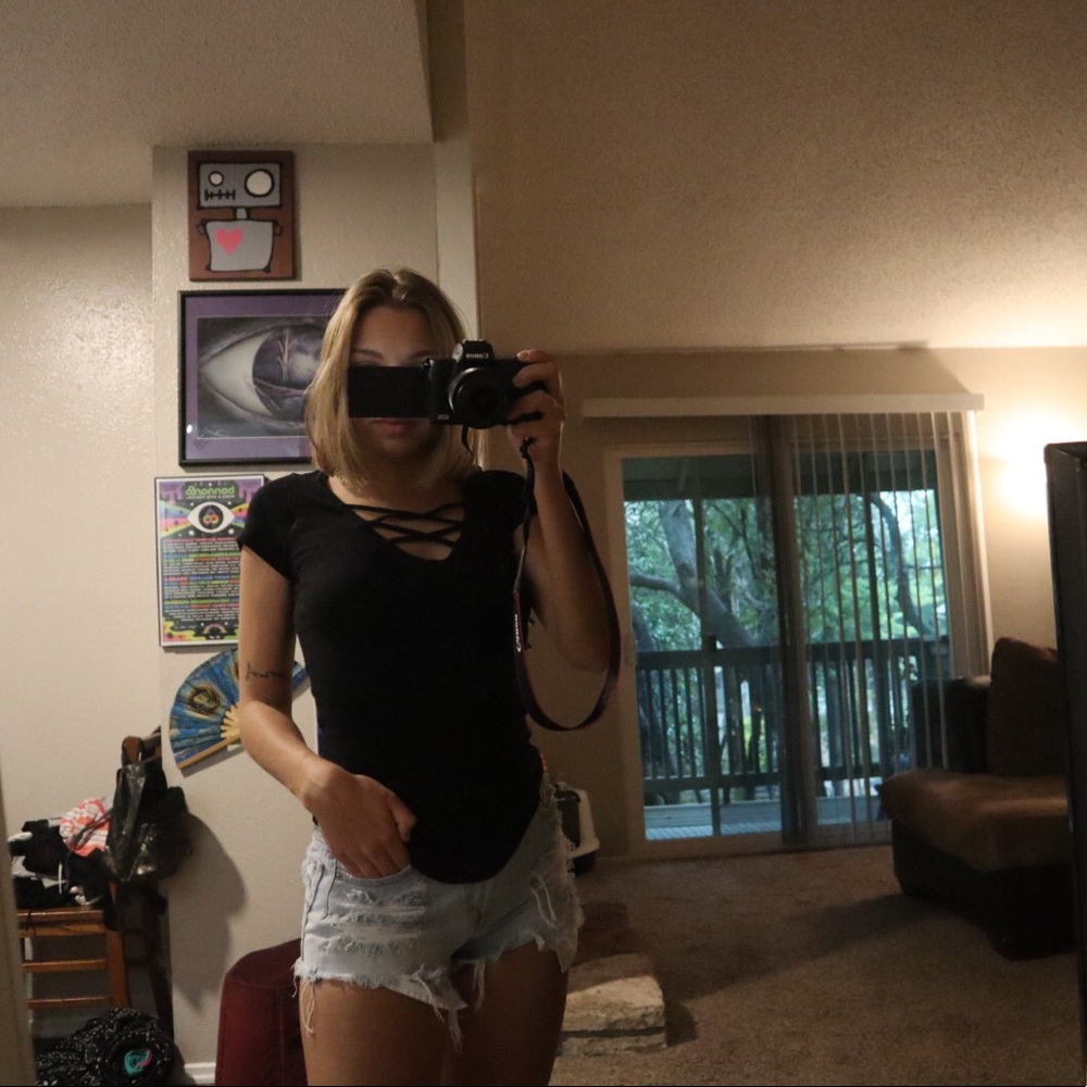 Black, fitted short sleeve top with chest details